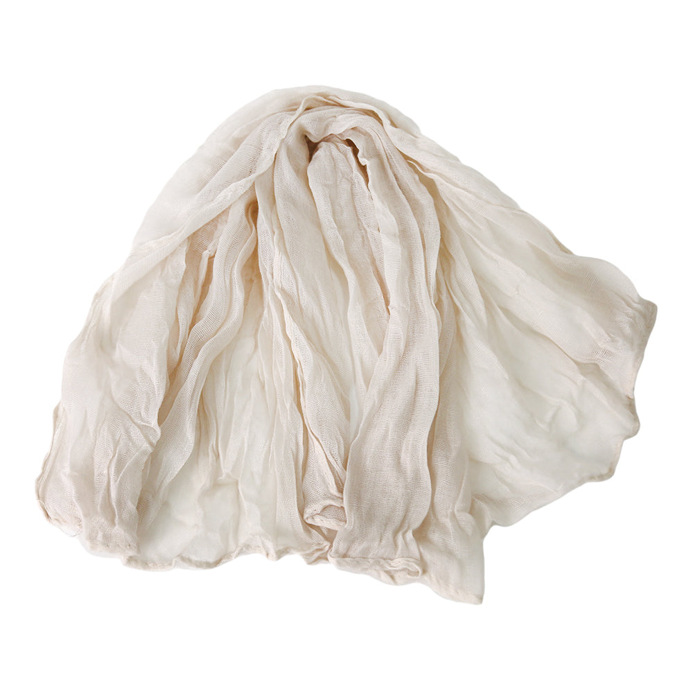 A gauze napkin in off white, made from soft cotton fabric. The subtle off white color adds a gentle and sophisticated touch to table settings, perfect for creating a light and elegant ambiance.