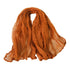A gauze napkin in burnt orange, made from soft cotton fabric. The vibrant burnt orange color adds a warm and lively touch to table settings, perfect for creating a bold and inviting atmosphere.