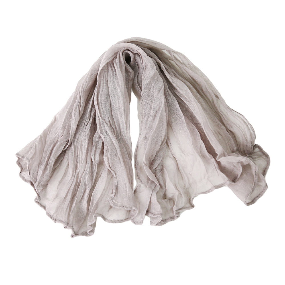 A gauze napkin in sand, made from soft cotton fabric. The warm sand color adds a subtle and elegant touch to table settings, perfect for creating a relaxed and sophisticated ambiance.