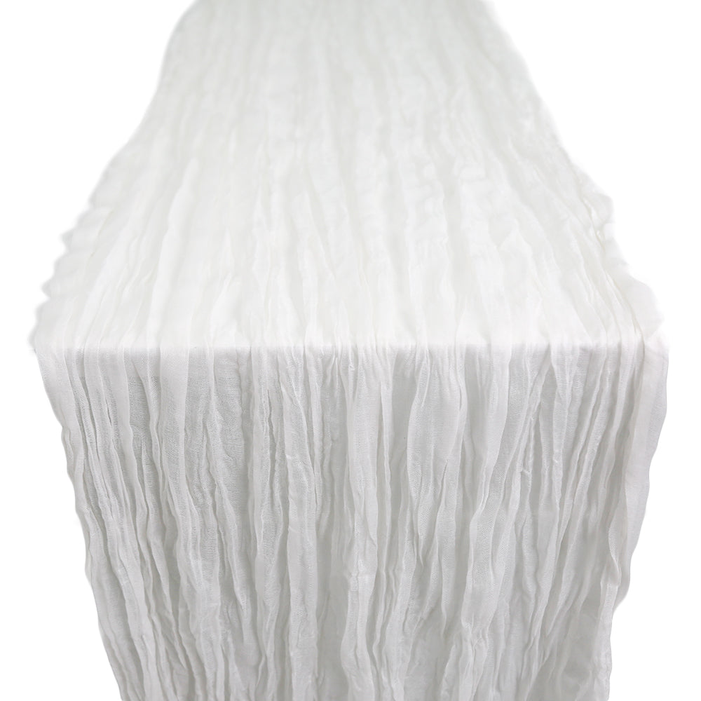A gauze table runner in light grey, featuring a soft and textured fabric. The neutral light grey color adds a modern and sophisticated touch to any table setting, perfect for creating a sleek and stylish ambiance.