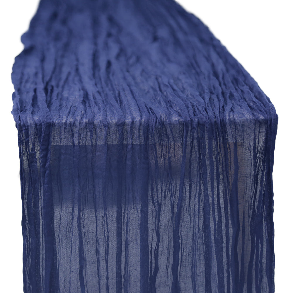 A gauze table runner in navy, featuring a soft and textured fabric. The deep navy color adds a rich and elegant touch to any table setting, ideal for creating a classic and refined atmosphere.
