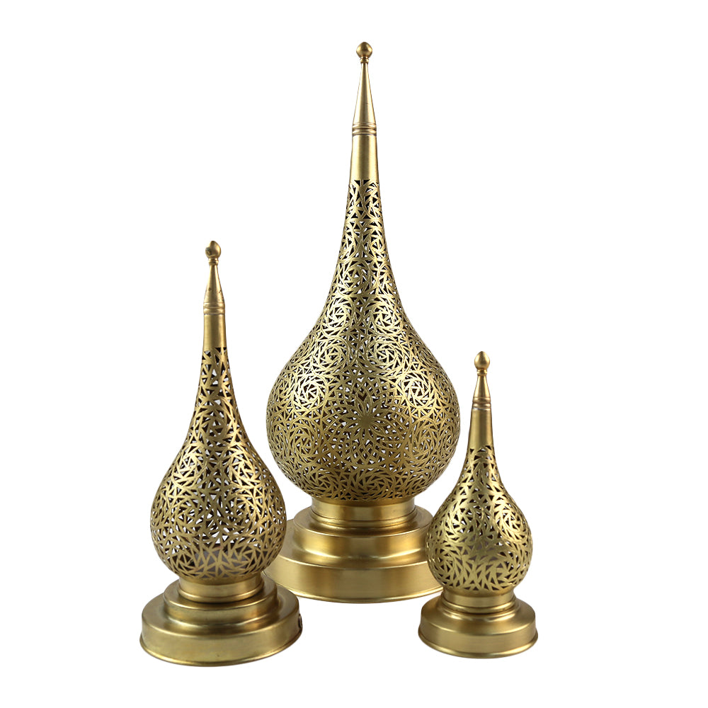 A brass table lamp, featuring a classic and elegant design. The lamp’s polished brass finish adds a touch of sophistication and warmth, making it a stylish addition to desks, bedside tables, or living areas. Ideal for both functional lighting and decorative purposes.
