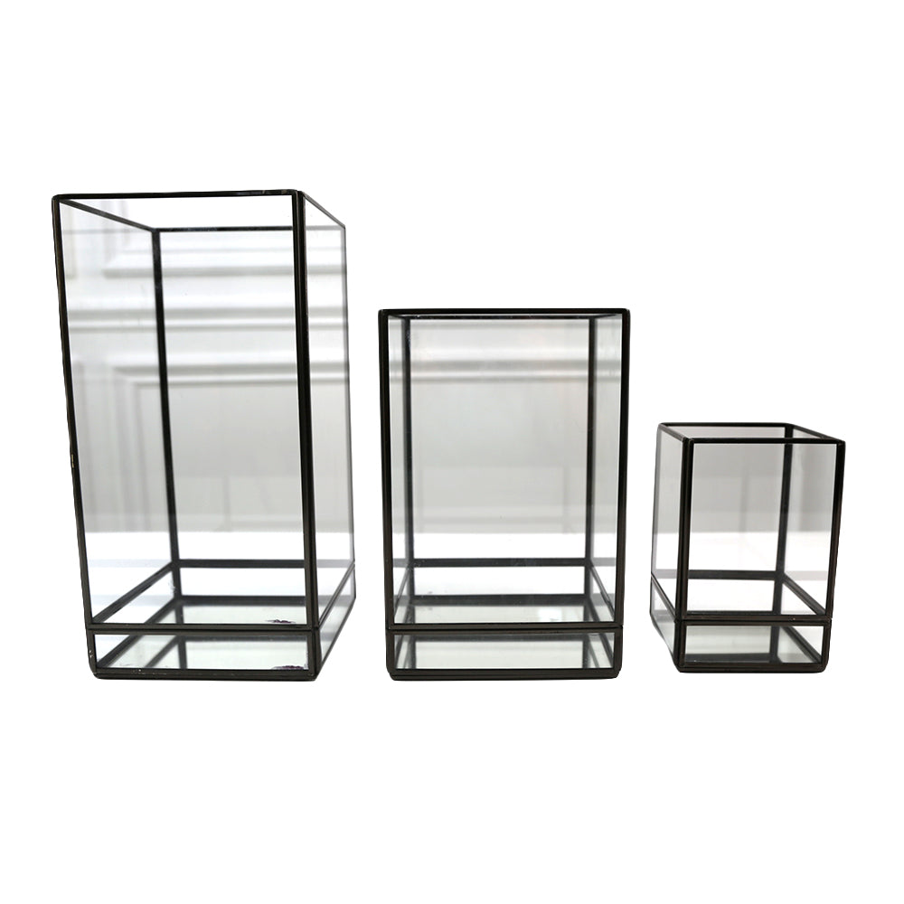 Modern Black Edge Lanterns, featuring a sleek and contemporary design in black. These lanterns add a stylish and sophisticated touch to any space, ideal for enhancing the ambiance of both indoor and outdoor settings with their modern edge and elegant appearance.