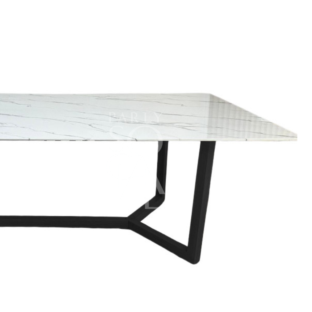 A table with a black base and a white marble top, featuring a chic and modern design. The black base offers a bold contrast to the crisp white marble top, creating a striking and sophisticated look. This table adds a touch of elegance and contemporary style to any space.