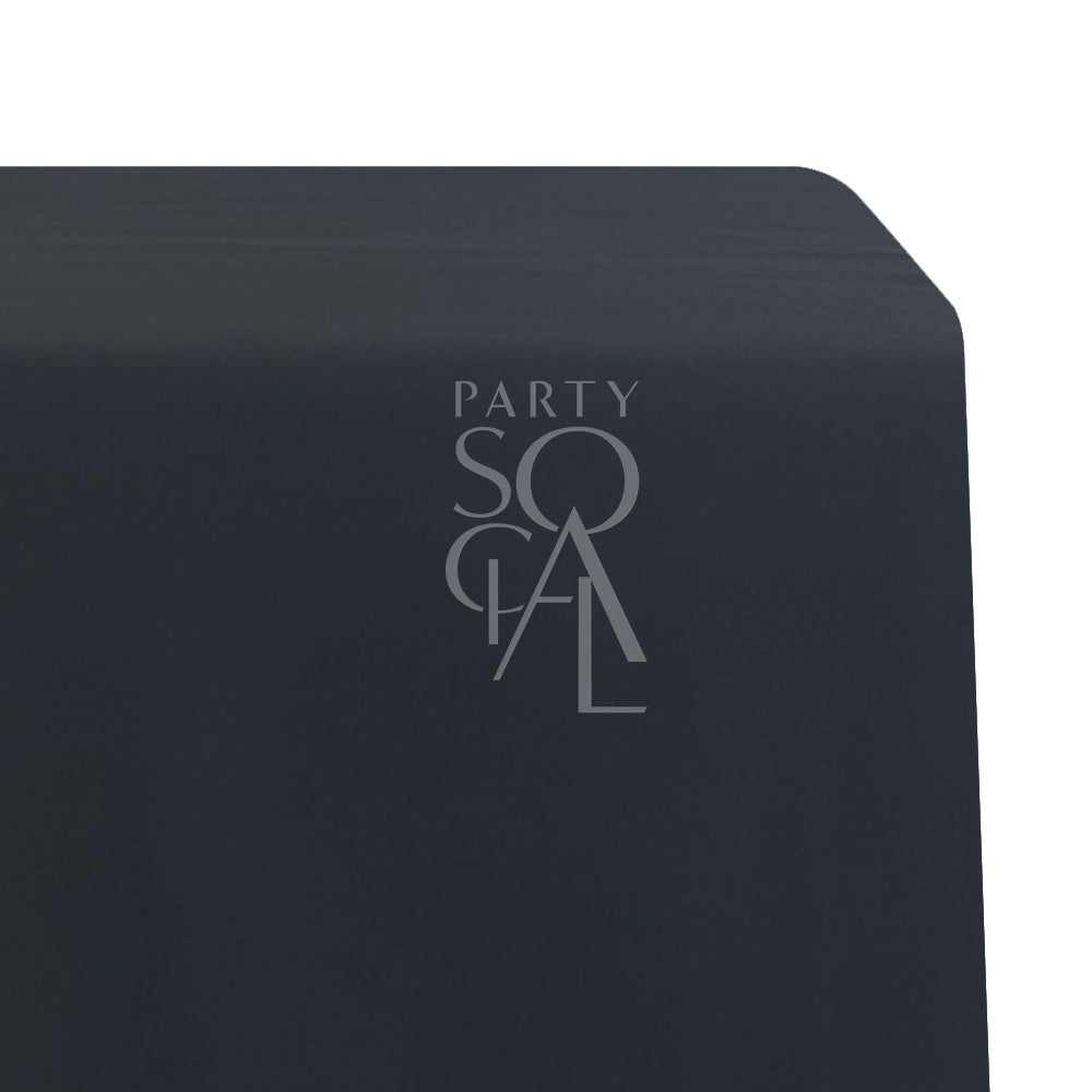 A rectangular satin tablecloth in classic black, featuring a sleek and glossy finish. This sophisticated tablecloth adds a touch of modern elegance and versatility to any dining setting, ideal for formal events and stylish occasions.