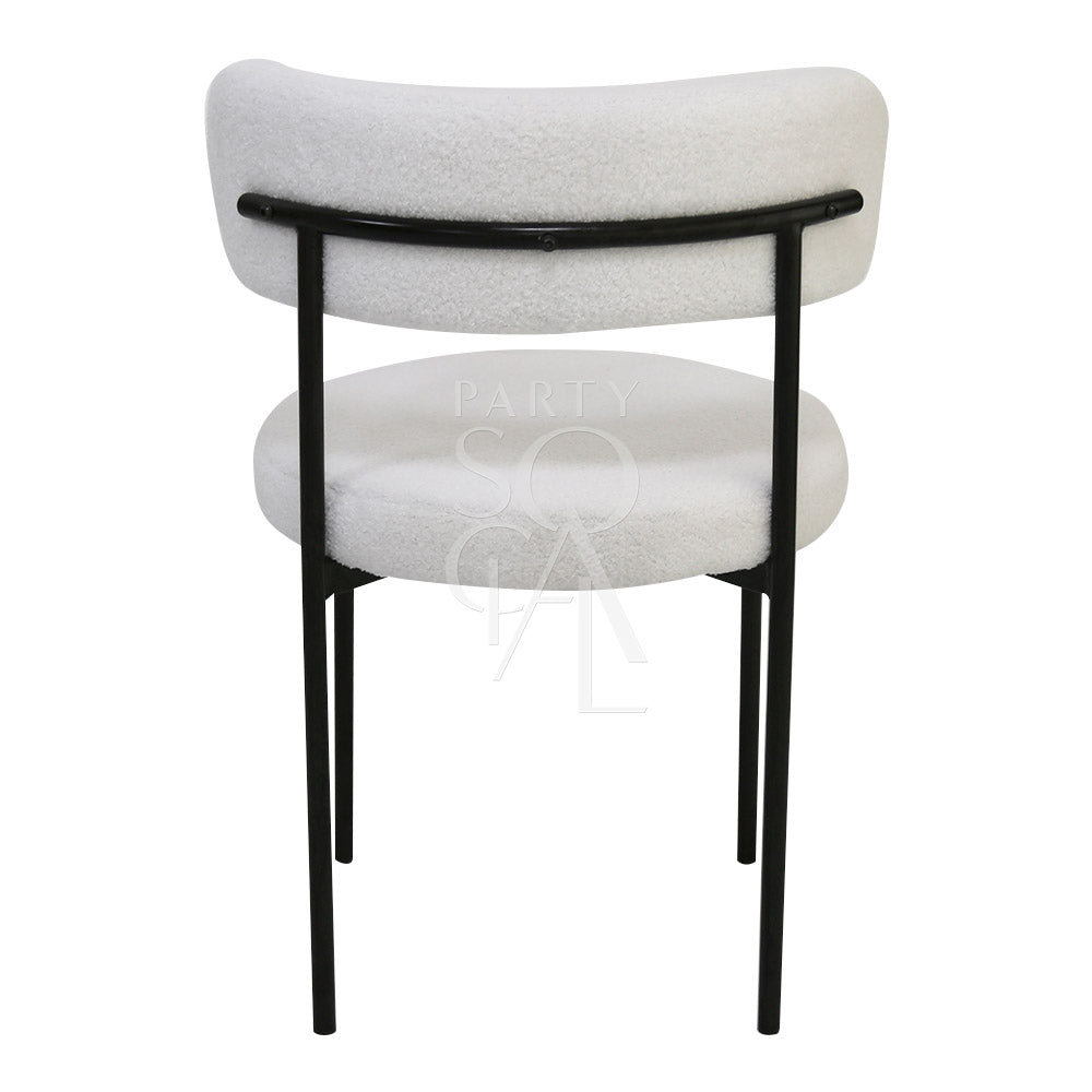 Boucle chairs featuring a textured and stylish design. The chairs are upholstered in boucle fabric, known for its unique, looped texture that adds a touch of elegance and sophistication. Ideal for enhancing the decor of living rooms, lounges, and dining areas with a comfortable and chic seating option.
