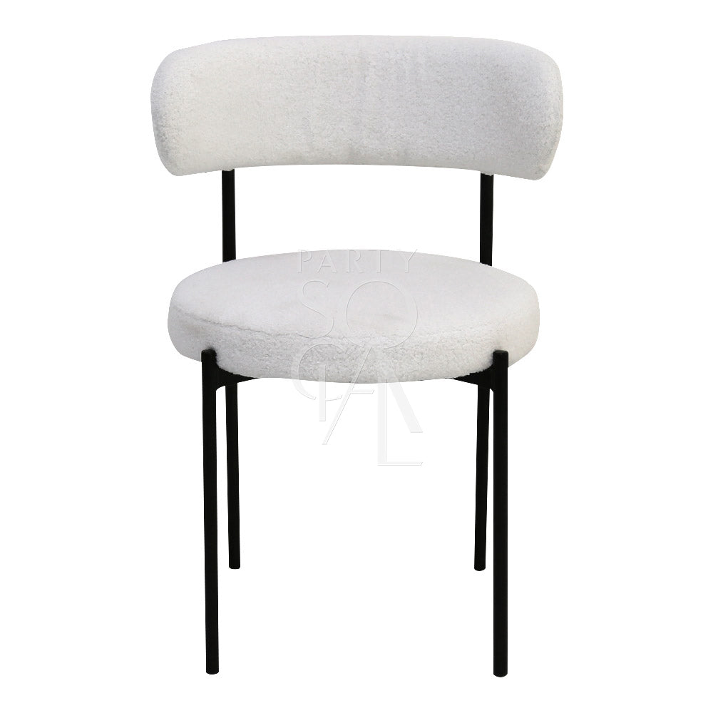 Boucle chairs featuring a textured and stylish design. The chairs are upholstered in boucle fabric, known for its unique, looped texture that adds a touch of elegance and sophistication. Ideal for enhancing the decor of living rooms, lounges, and dining areas with a comfortable and chic seating option.