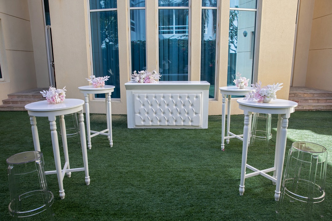 Stylish white wood cocktail table with a clean and classic design, offering a versatile and elegant addition to any living room or entertaining space.