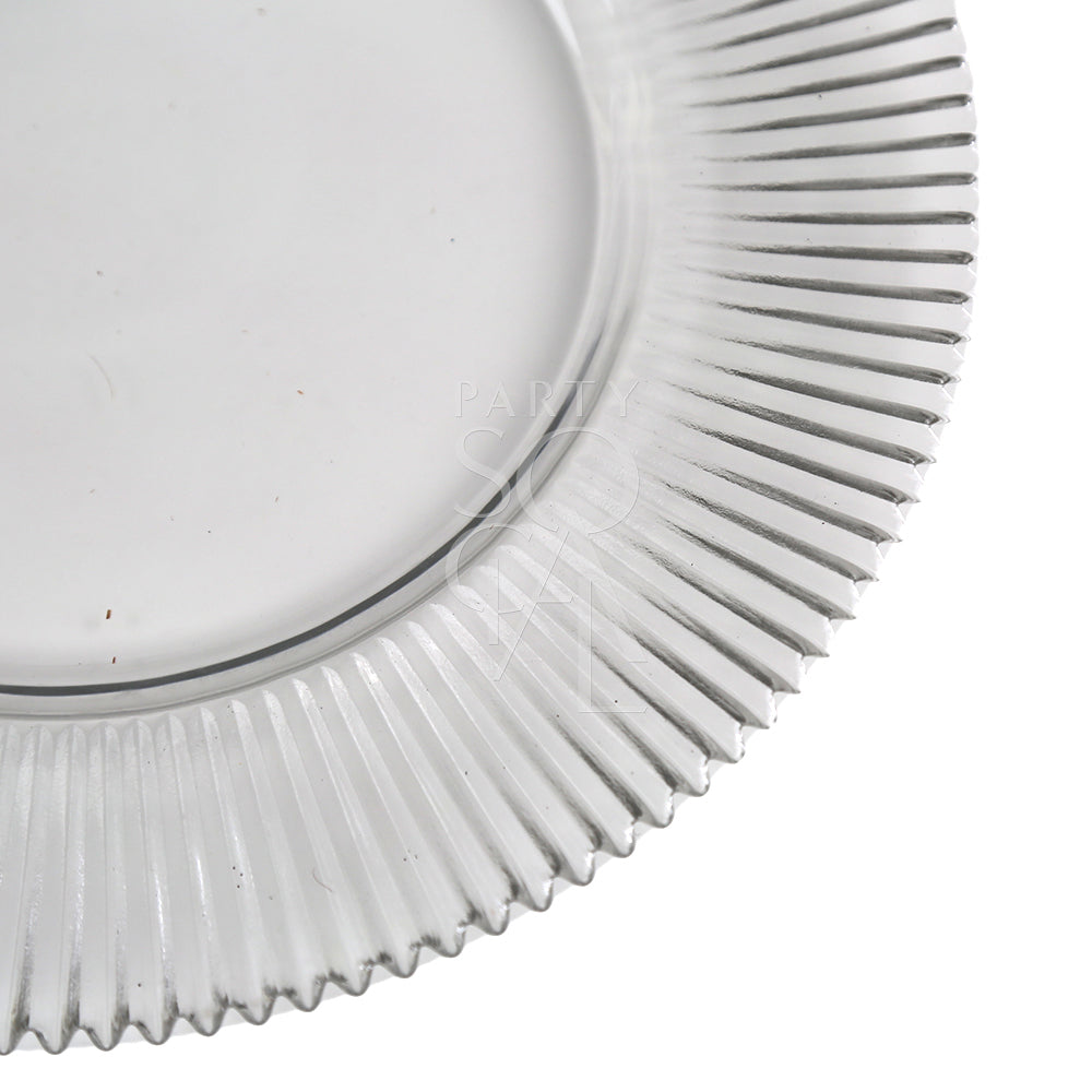 A clear charger plate with a lined design, offering a sleek and minimalist look. The transparent finish enhances any table setting with a subtle, elegant touch.