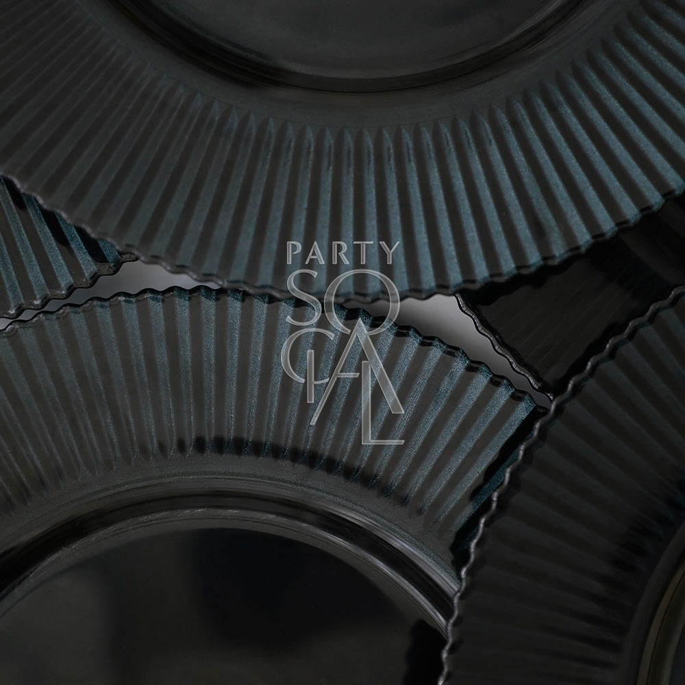 A midnight blue charger plate with a lined texture, adding a rich and luxurious touch to your table setting. The deep blue hue creates a striking contrast and enhances the overall elegance of the decor.