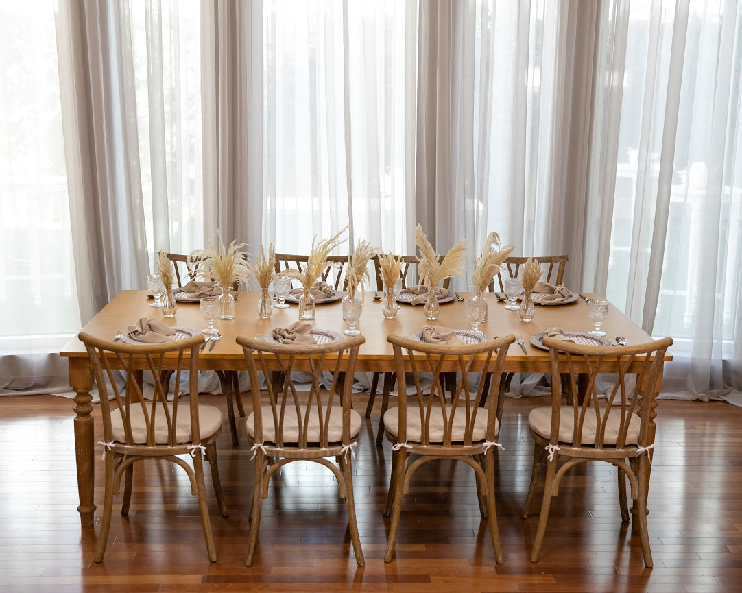 Crisscross chair crafted from oak wood, featuring a distinctive crisscross back design. This chair combines durability with timeless style, showcasing the natural beauty of oak wood. Its elegant and sturdy construction makes it a versatile addition to both traditional and contemporary interiors, suitable for dining areas, offices, or living spaces.