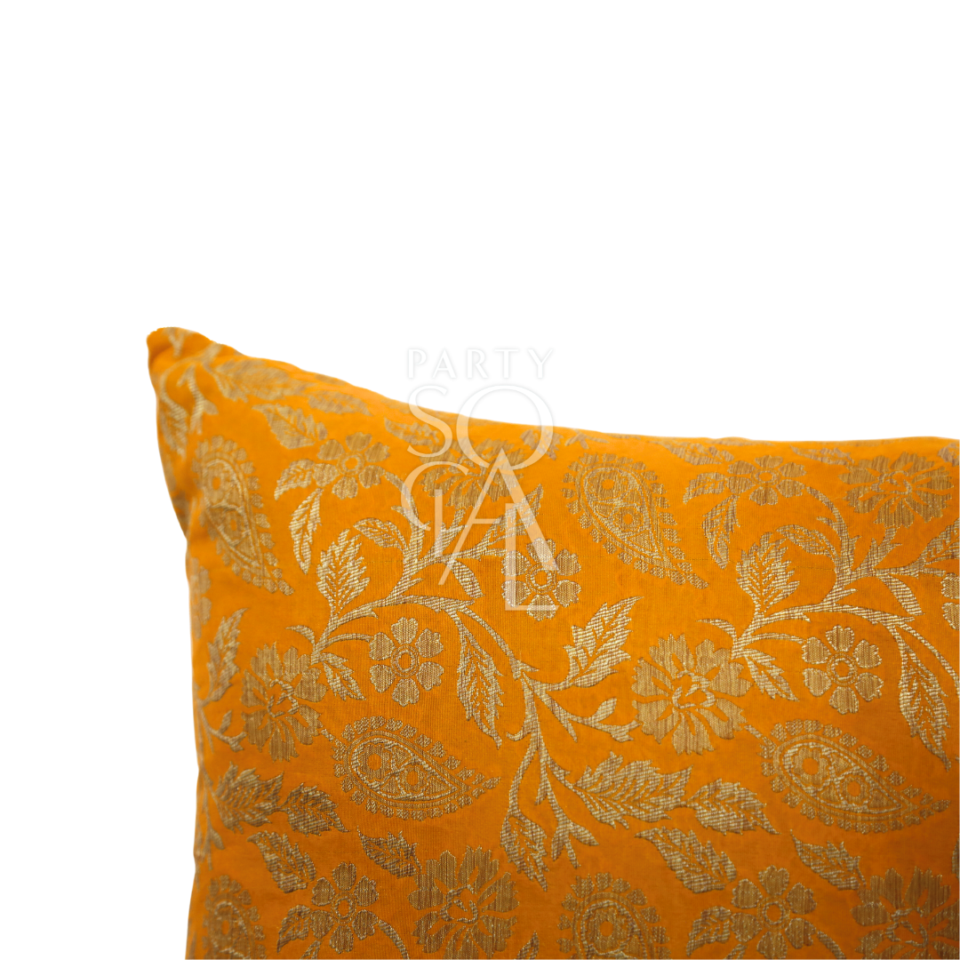 A cushion cover in brocade, featuring a luxurious and intricate pattern with rich textures and details. The brocade fabric adds an elegant and opulent touch, perfect for enhancing the decor of sofas, chairs, or beds with a sophisticated and stylish accent.