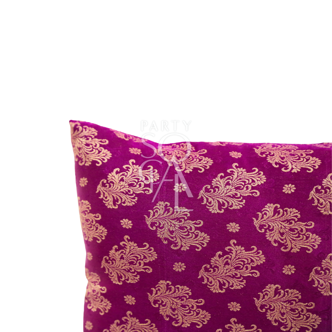 A cushion cover in brocade, featuring a luxurious and intricate pattern with rich textures and details. The brocade fabric adds an elegant and opulent touch, perfect for enhancing the decor of sofas, chairs, or beds with a sophisticated and stylish accent.