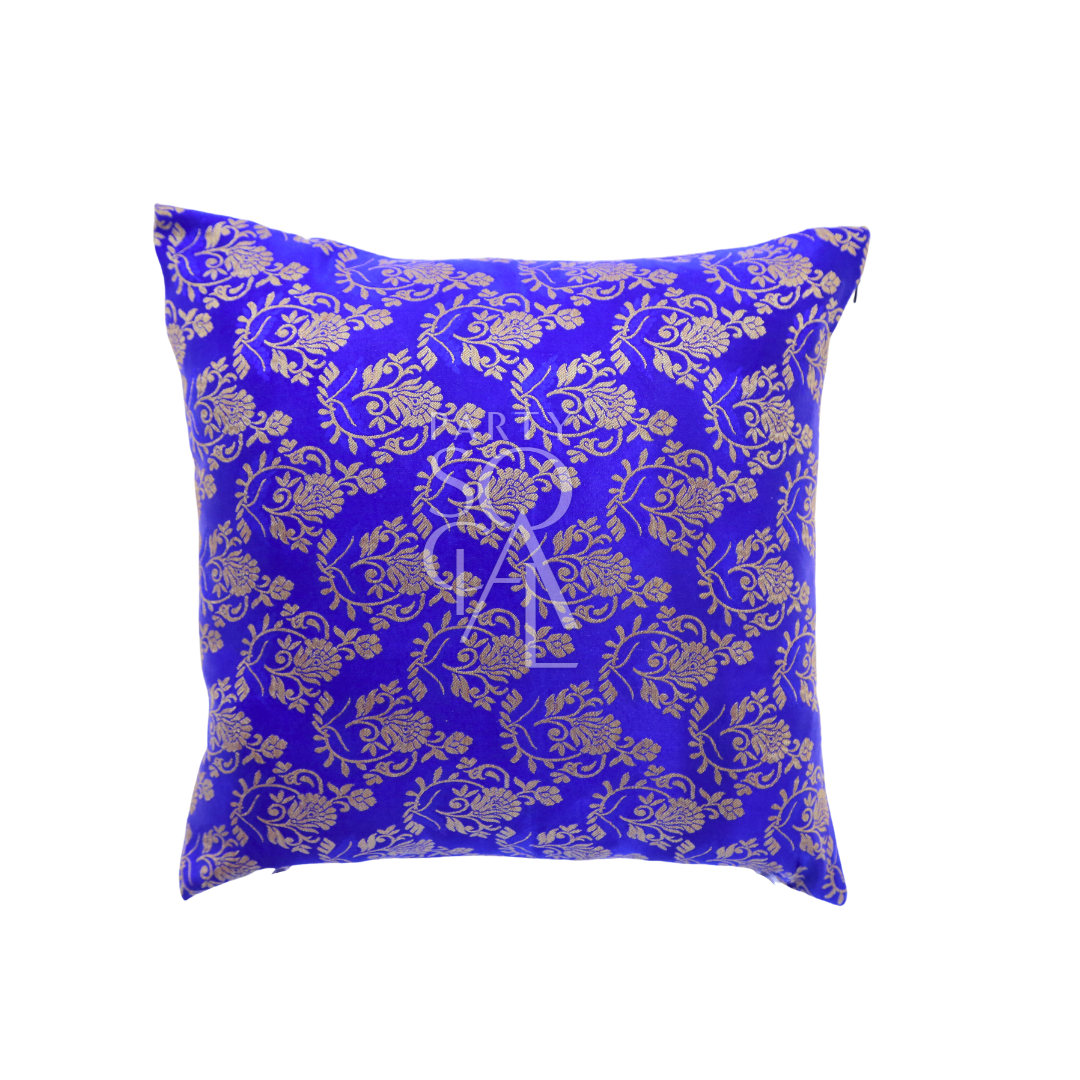 A cushion cover in brocade, featuring a luxurious and intricate pattern with rich textures and details. The brocade fabric adds an elegant and opulent touch, perfect for enhancing the decor of sofas, chairs, or beds with a sophisticated and stylish accent.