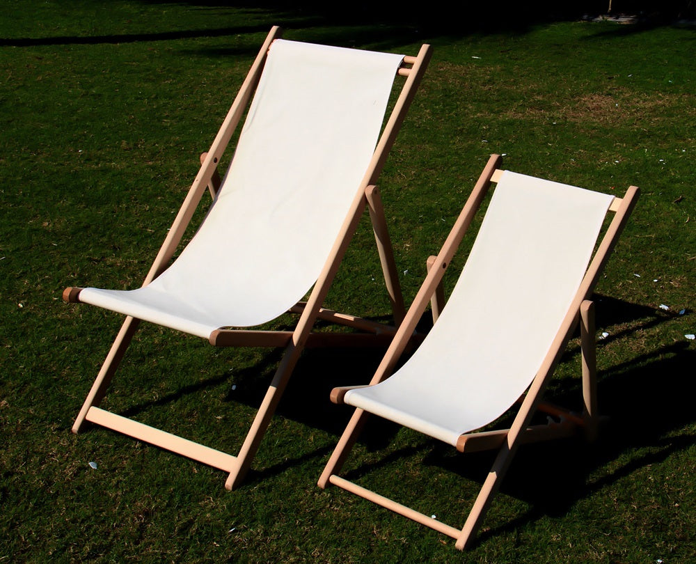 Classic wooden deckchairs with a sturdy frame and natural finish, providing comfortable and stylish outdoor seating, perfect for relaxing on patios, gardens, or beach settings.