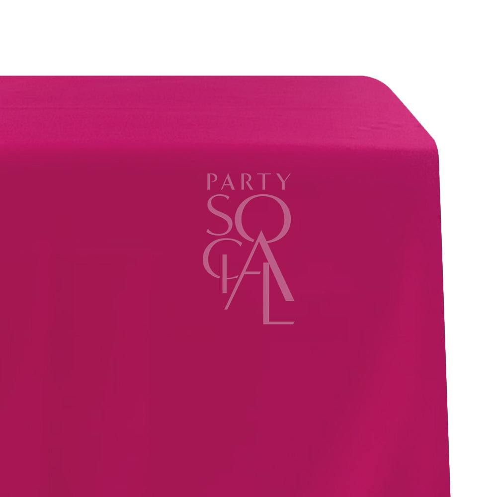A rectangular satin tablecloth in vibrant fuchsia, featuring a glossy and eye-catching finish. This stylish tablecloth adds a pop of color and a touch of glamour to any event, perfect for lively gatherings and celebrations.