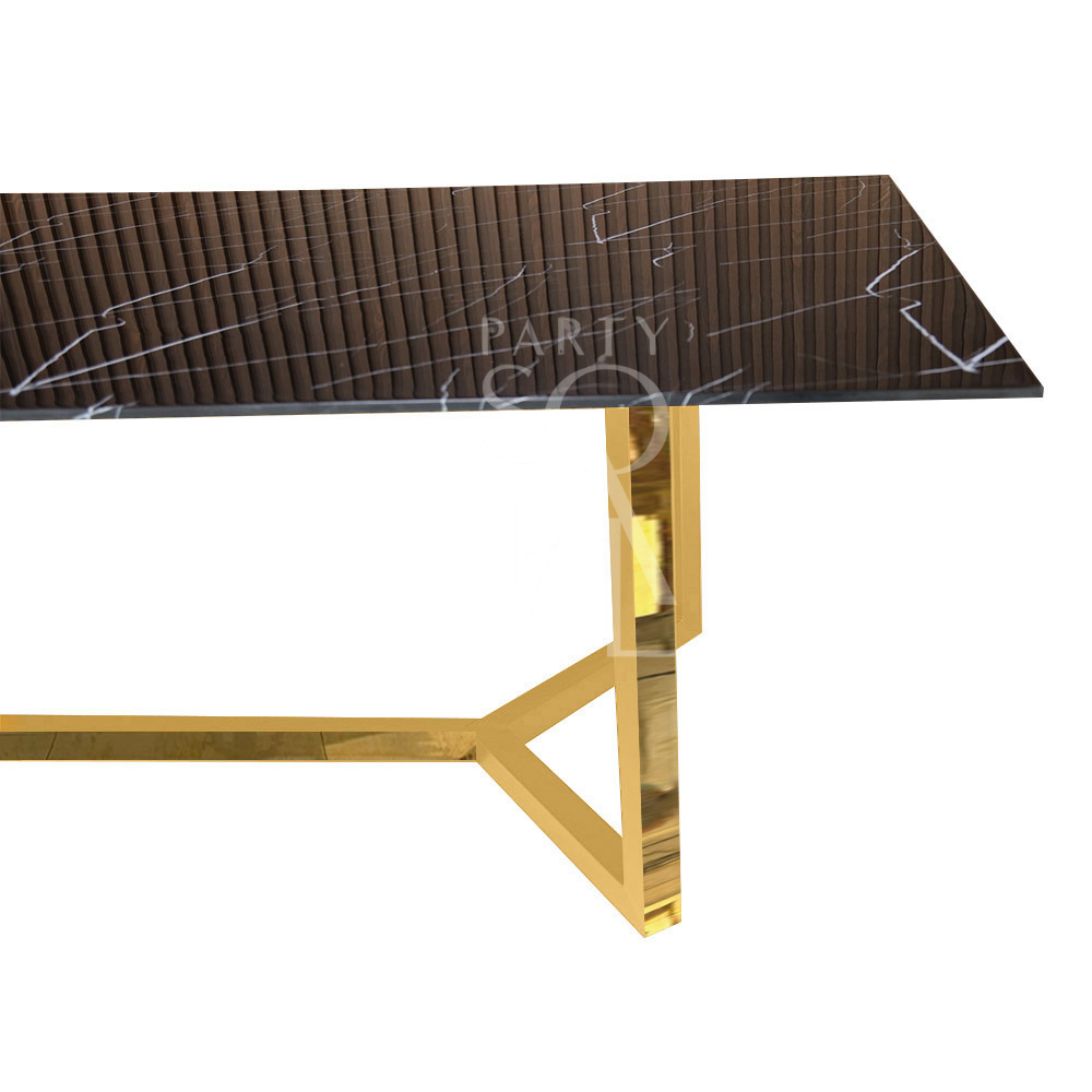 A table with a gold base and a black marble top, featuring a bold and luxurious design. The gold base offers a striking contrast to the deep, rich black marble top, creating a sophisticated and modern look. This elegant table enhances any decor with its refined and dramatic style.