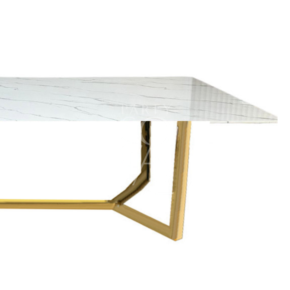 A table with a gold base and a white marble top, featuring a luxurious and elegant design. The gold base adds a touch of opulence, while the white marble top provides a classic and sophisticated finish. This striking combination enhances any decor with its refined and glamorous look.