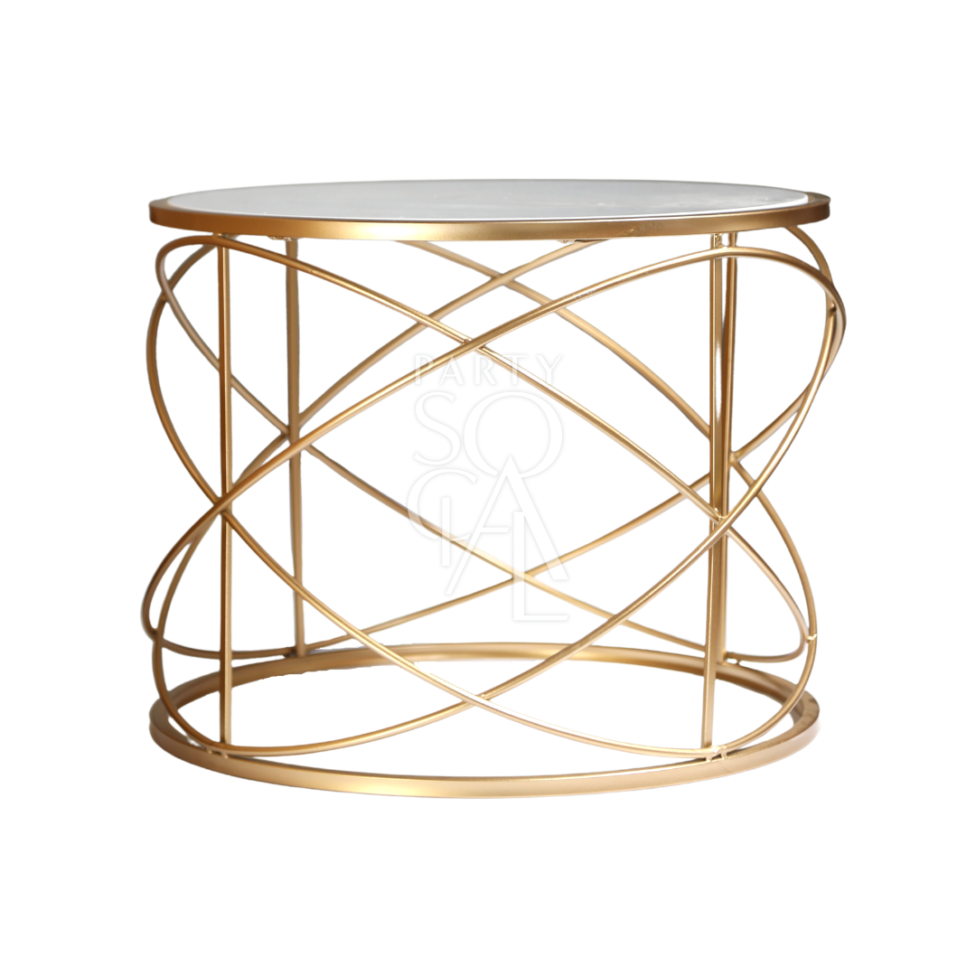 A gold wire coffee table with a marble top featuring a chic and modern design. This stylish table boasts a luxurious marble surface paired with an elegant gold wireframe, creating a striking centerpiece for any living room or lounge. Perfect for adding a touch of sophistication and contemporary flair to your space while providing a functional surface for drinks, decor, and more.