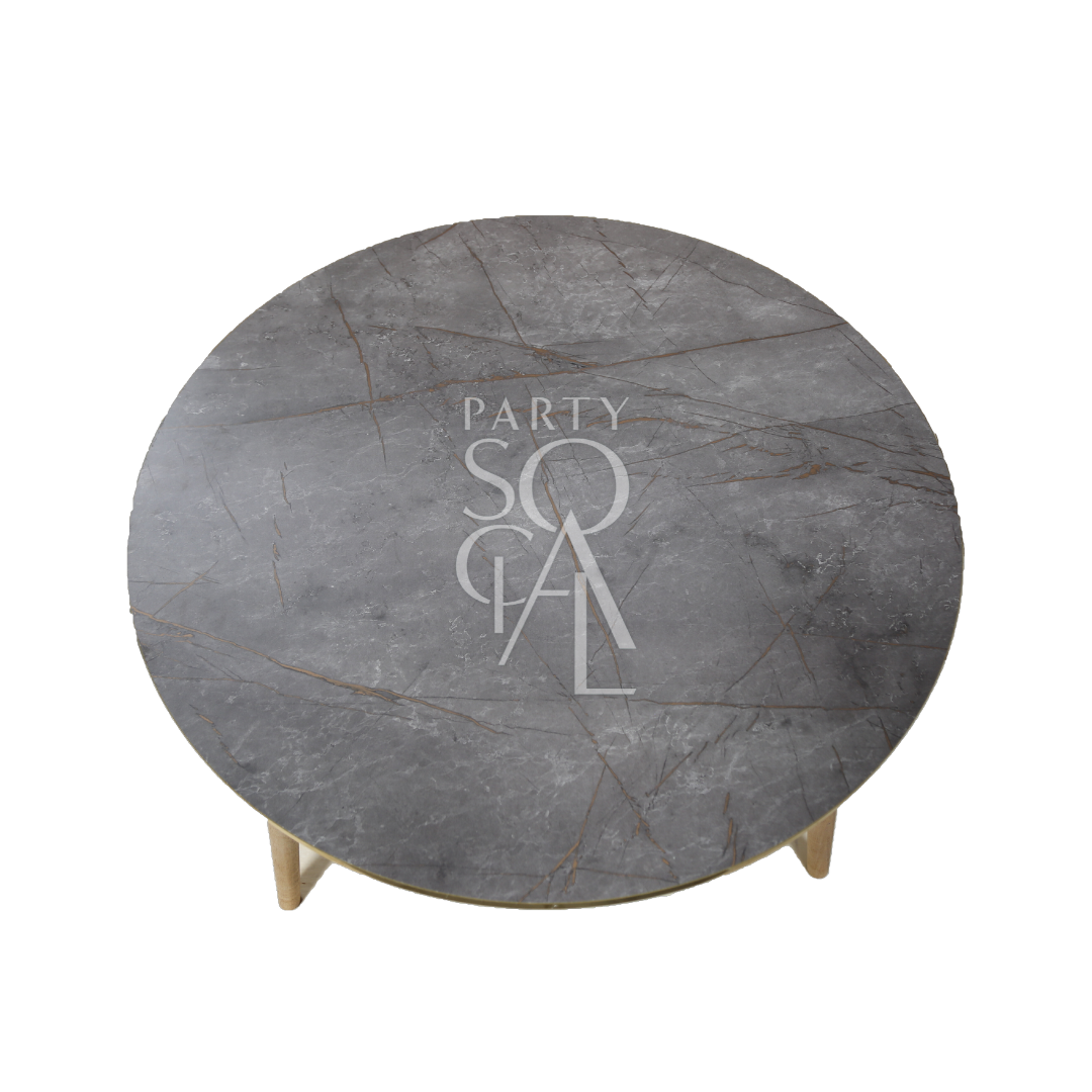 A grey gold-rimmed coffee table featuring a modern and elegant design. This stylish table has a sleek grey surface complemented by a luxurious gold rim, adding a touch of sophistication to any room. Perfect for living rooms, lounges, or offices, it combines functionality with contemporary flair, ideal for displaying decor items or serving drinks and snacks.