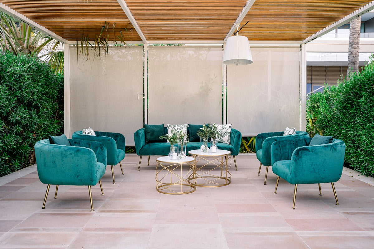 Luxurious 3-seater sofa in rich royal green velvet. The sofa boasts a sumptuous texture, offering both elegance and comfort with its plush cushioning and sleek, modern design. Perfect for adding a bold touch of color and sophistication to any room.