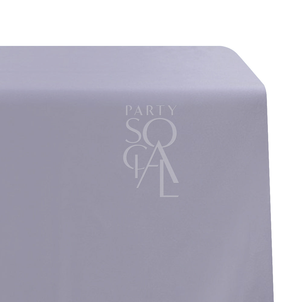 A rectangular satin tablecloth in soft lilac, with a smooth and lustrous texture. This charming tablecloth adds a touch of elegance and serenity to your dining area, ideal for special occasions and stylish events.