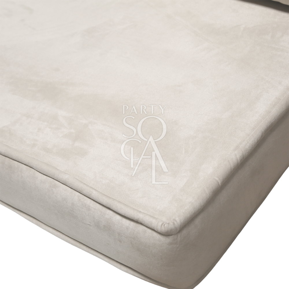 Spacious and modern lounge low seating arrangement featuring plush cushions and a sleek, low-profile design. The seating area includes a combination of modular pieces with soft upholstery in a neutral color palette, ideal for creating a comfortable and stylish relaxation space in contemporary living areas