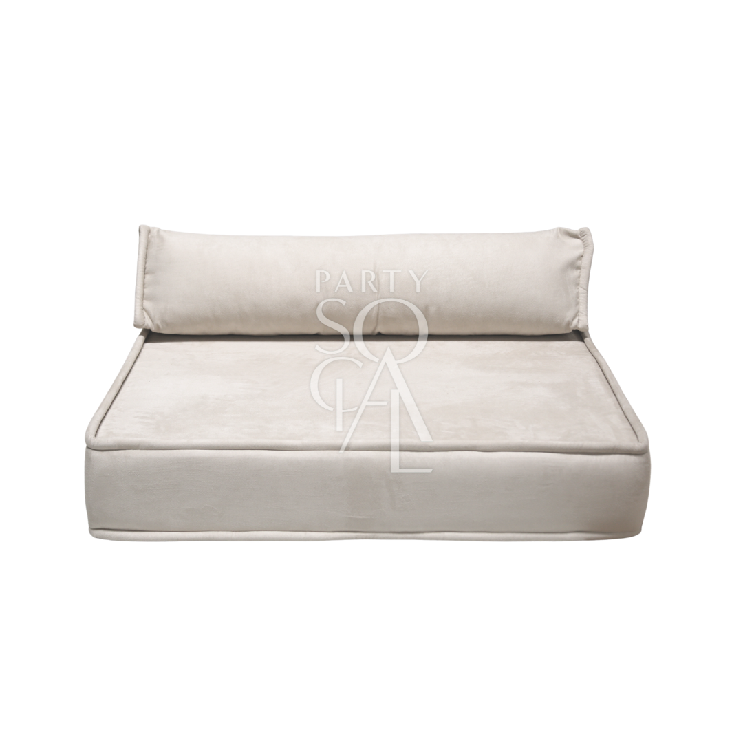 Spacious and modern lounge low seating arrangement featuring plush cushions and a sleek, low-profile design. The seating area includes a combination of modular pieces with soft upholstery in a neutral color palette, ideal for creating a comfortable and stylish relaxation space in contemporary living areas