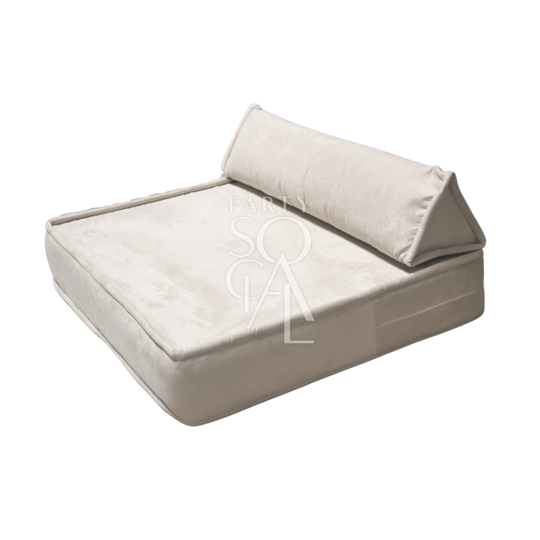 Spacious and modern lounge low seating arrangement featuring plush cushions and a sleek, low-profile design. The seating area includes a combination of modular pieces with soft upholstery in a neutral color palette, ideal for creating a comfortable and stylish relaxation space in contemporary living areas