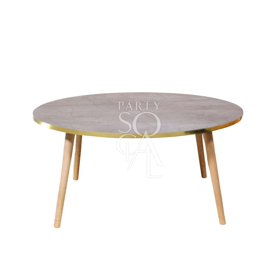 A grey gold-rimmed coffee table featuring a modern and elegant design. This stylish table has a sleek grey surface complemented by a luxurious gold rim, adding a touch of sophistication to any room. Perfect for living rooms, lounges, or offices, it combines functionality with contemporary flair, ideal for displaying decor items or serving drinks and snacks.