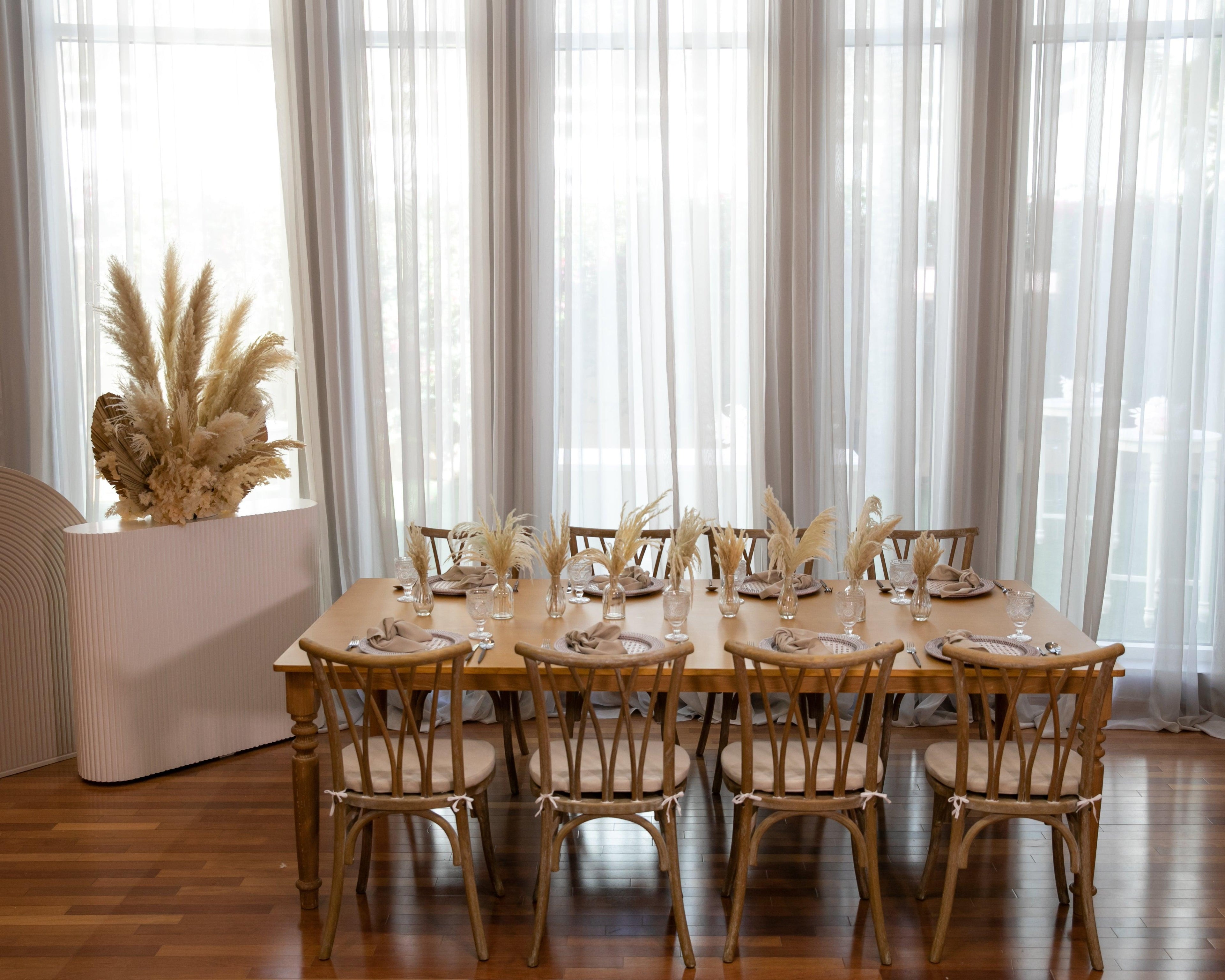 Boho & Woods party package featuring a vibrant and customizable setup designed to make your party unforgettable. This package includes a table, chairs, tableware, and centerpieces, all arranged in a simple yet classy look to ensure a remarkable event. Perfect for a party of 8 guests, with options to add more tables, chairs, and additional furniture as needed