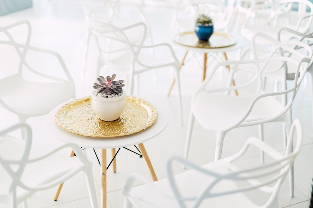 White replica Masters chair, designed with a distinctive interwoven backrest and modern aesthetic, offering a stylish and comfortable seating option.