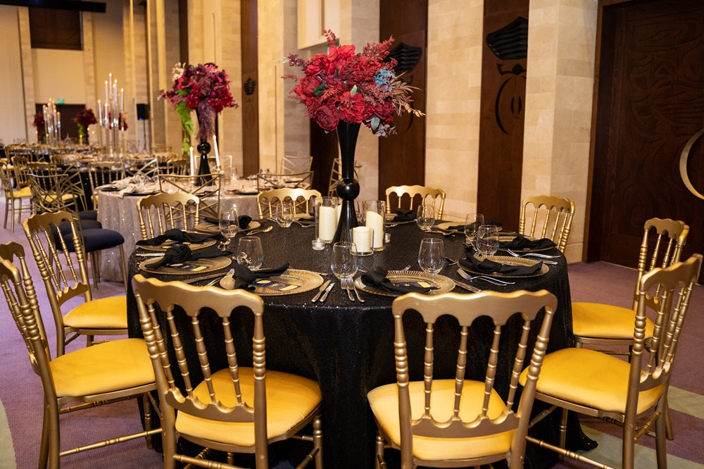 Napoleon gold chair with a luxurious, gilded finish. This classic chair design features an ornate back and legs, highlighted by a rich gold color that adds a touch of elegance and opulence. Ideal for upscale events, formal dining, or stylish interior spaces, it blends traditional charm with a glamorous gold hue.