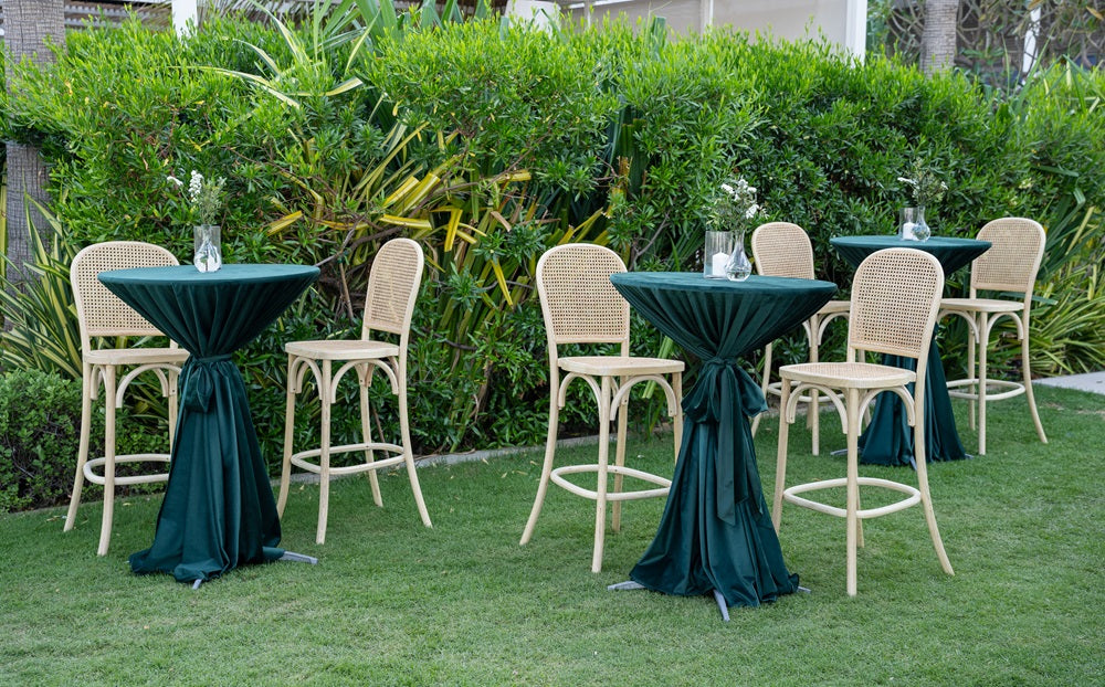 A wood rattan stool, featuring a natural and rustic design. The stool combines a sturdy wooden frame with a rattan seat, offering a stylish and comfortable seating option. Perfect for adding a touch of organic charm to any space, whether for home decor, cafes, or casual seating areas.