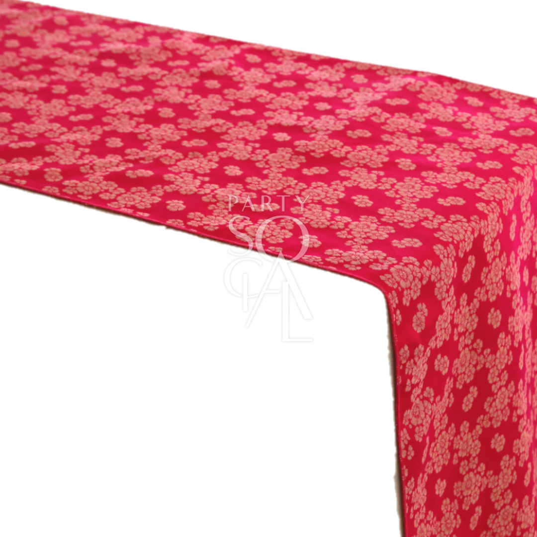 A cushion cover in vibrant fuchsia brocade, showcasing an ornate pattern with rich textures and sophisticated design. Ideal for adding a bold and stylish accent to any living space or bedroom.
