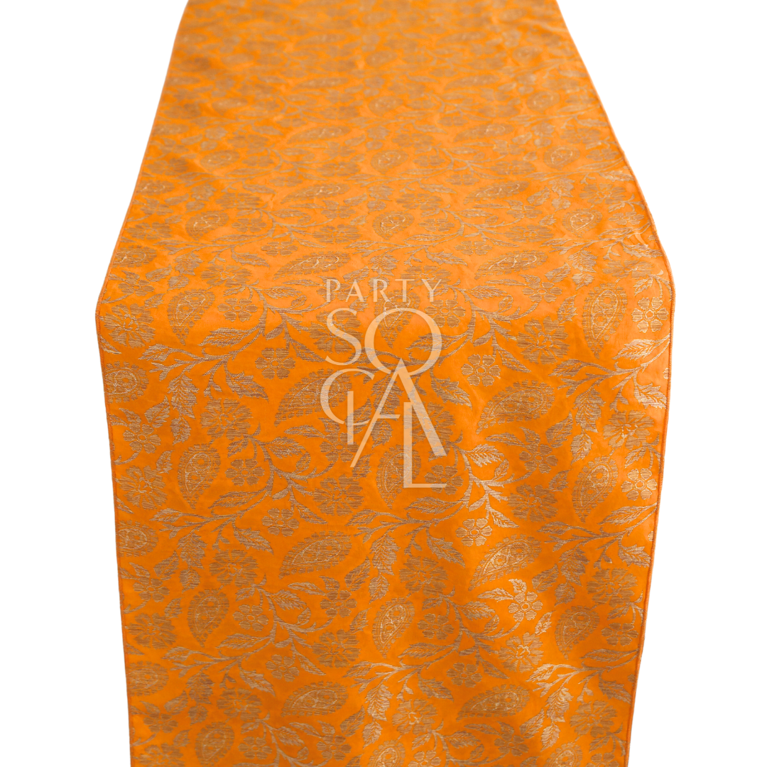 A cushion cover in mustard brocade, featuring a warm and elegant pattern with detailed textures. This cover adds a touch of opulence and style to sofas, chairs, or beds, perfect for enhancing any decor.