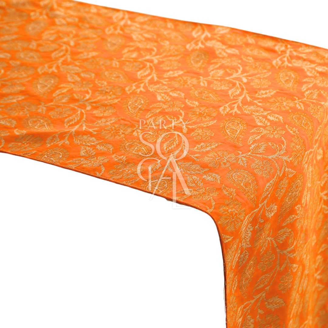 A cushion cover in mustard brocade, featuring a warm and elegant pattern with detailed textures. This cover adds a touch of opulence and style to sofas, chairs, or beds, perfect for enhancing any decor.