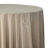 A round velvet tablecloth in soft sand, featuring a luxurious and plush texture. This elegant tablecloth adds a touch of warmth and sophistication to your dining area, perfect for both casual and formal settings.