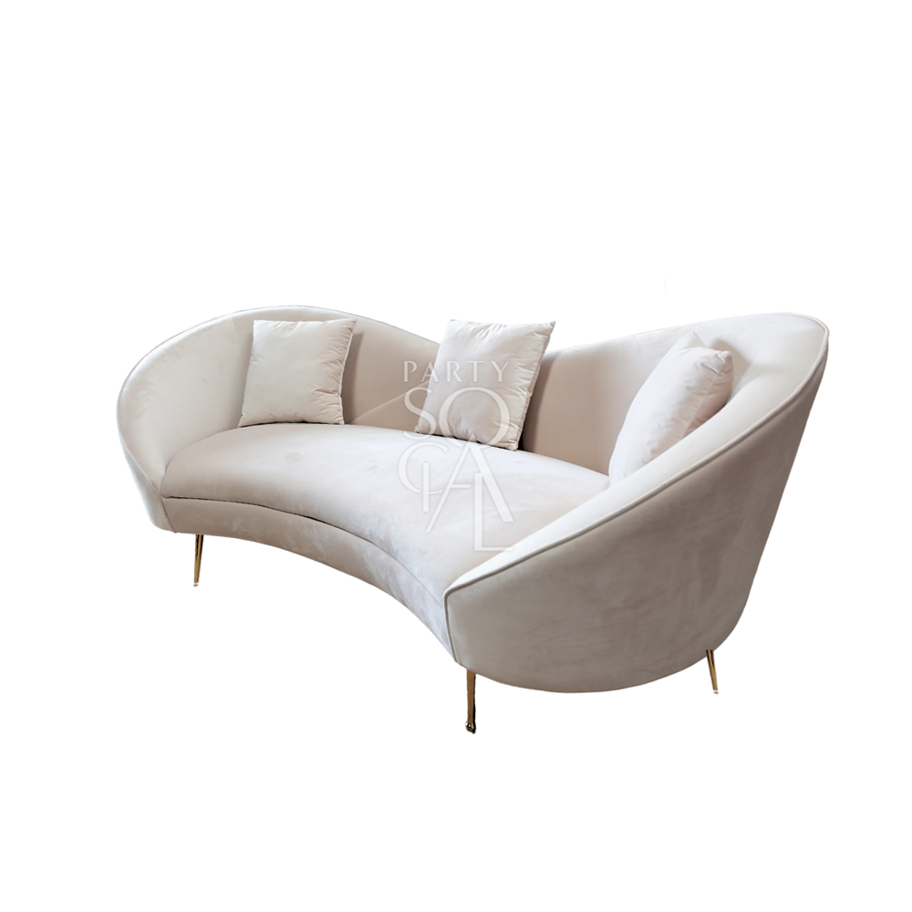 Kosha sand velvet sofa featuring a luxurious and elegant design. This sofa is upholstered in soft sand-colored velvet, providing a plush and sophisticated seating experience. Its sleek lines and rich texture make it a stylish centerpiece for any living room or lounge area, perfect for adding a touch of opulence and comfort to your space.