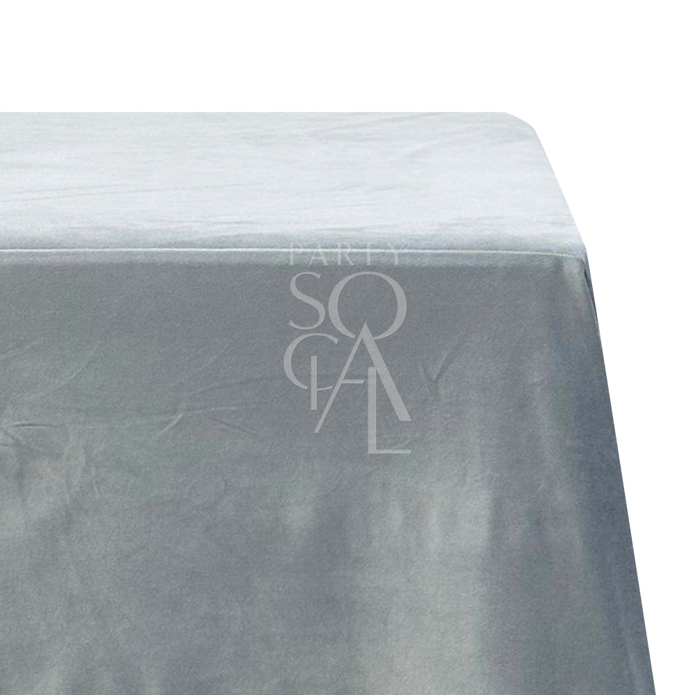 A rectangular velvet tablecloth in steel blue, featuring a cotton/linen blend. This elegant tablecloth combines a modern, cool-toned hue with a soft, luxurious texture, perfect for enhancing your dining space with a chic and contemporary look.