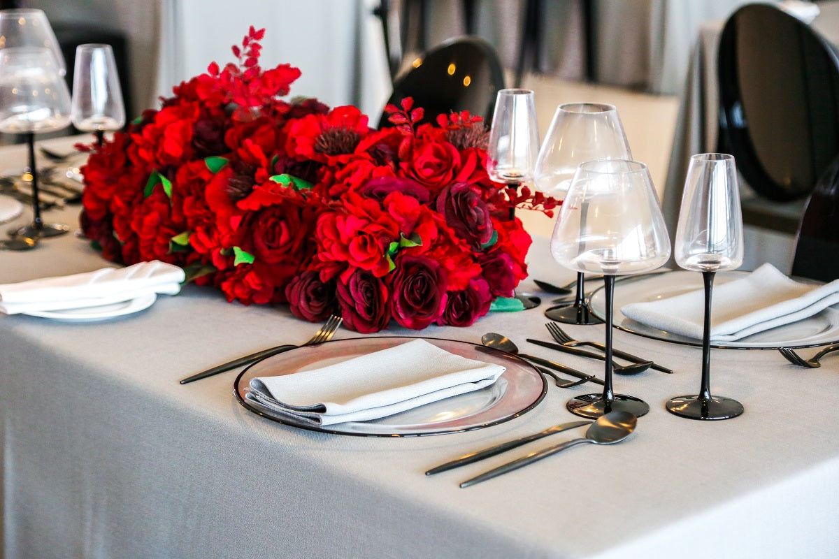 Black stemmed glasses featuring a sleek and modern design. These glasses have a transparent bowl with a striking black stem, adding a contemporary and stylish touch to your table setting. Perfect for enhancing the presentation of drinks at formal dinners, special events, or chic gatherings.