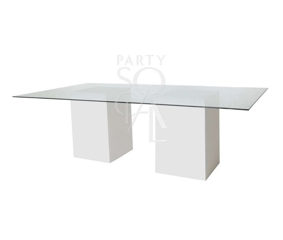 Modern glass dining table featuring a sleek, transparent tabletop supported by a sturdy, minimalist base. The clear glass surface enhances the table’s elegant design, making it a versatile and stylish choice for contemporary dining spaces and modern interiors.