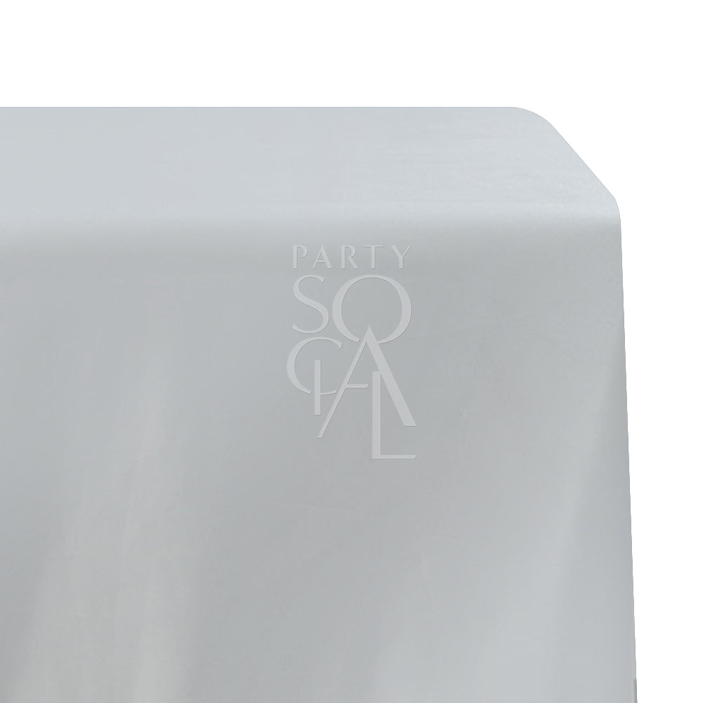 A rectangular satin tablecloth in pristine white, featuring a smooth and lustrous finish. This elegant tablecloth enhances any dining setting with its classic and sophisticated look, perfect for formal events and special occasions.