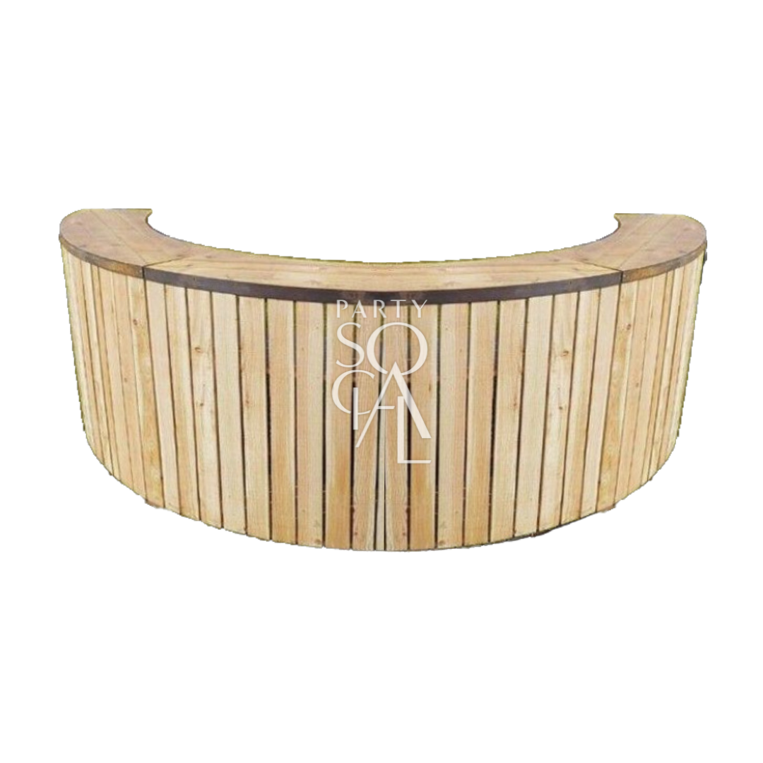 A semi wooden bar unit featuring a blend of wood and modern materials. This stylish bar unit combines natural wooden elements with contemporary design, creating a sophisticated and versatile addition to any bar or event space. Perfect for serving drinks and entertaining guests, it adds a warm and elegant touch to any setting.