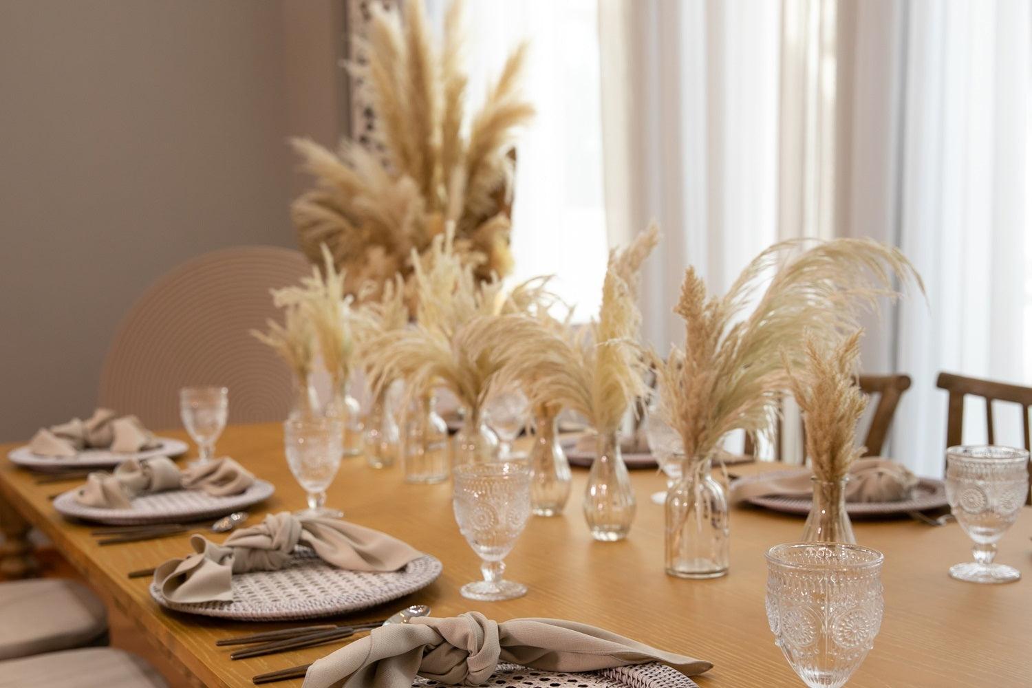 Boho & Woods party package featuring a vibrant and customizable setup designed to make your party unforgettable. This package includes a table, chairs, tableware, and centerpieces, all arranged in a simple yet classy look to ensure a remarkable event. Perfect for a party of 8 guests, with options to add more tables, chairs, and additional furniture as needed