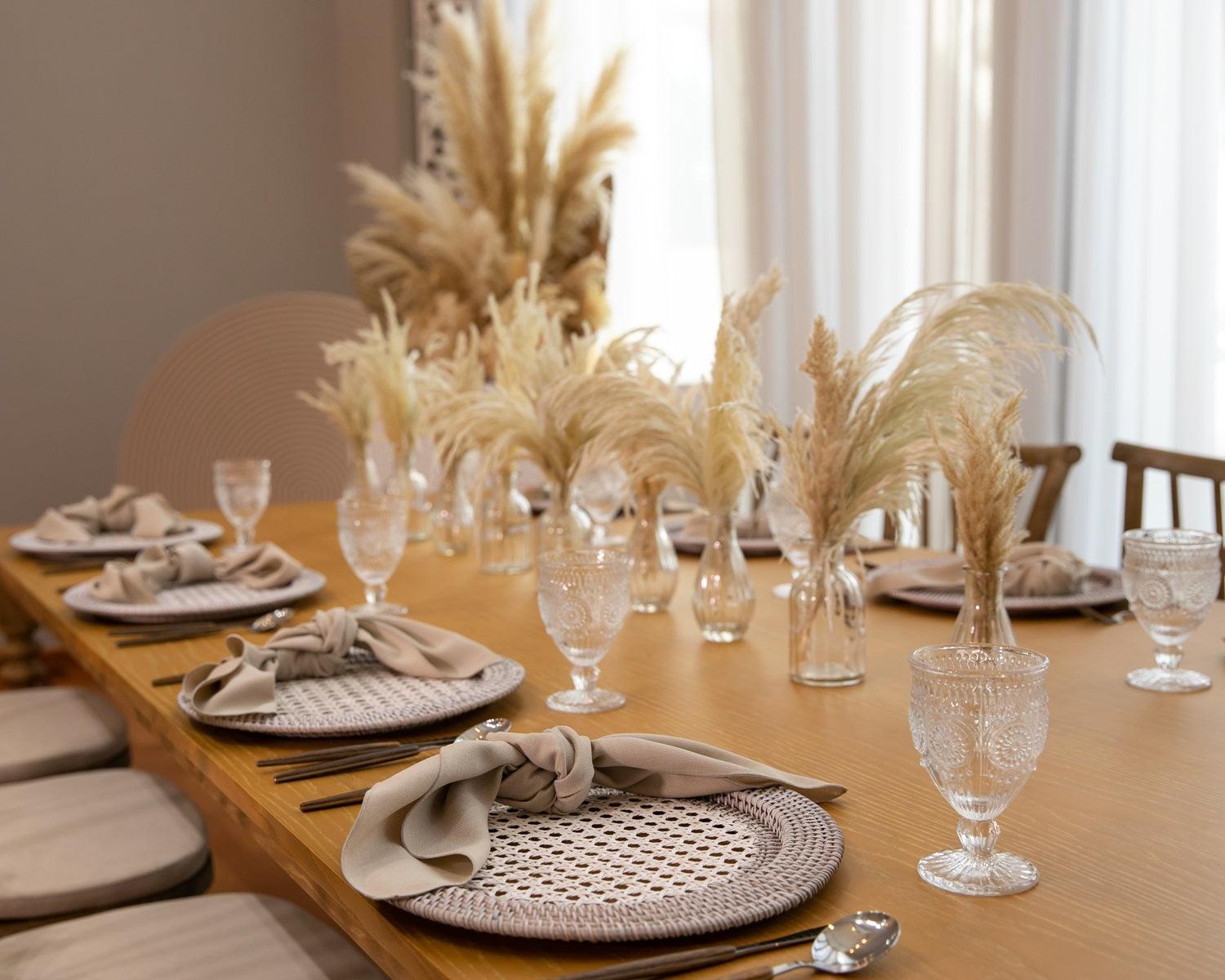 Boho & Woods party package featuring a vibrant and customizable setup designed to make your party unforgettable. This package includes a table, chairs, tableware, and centerpieces, all arranged in a simple yet classy look to ensure a remarkable event. Perfect for a party of 8 guests, with options to add more tables, chairs, and additional furniture as needed