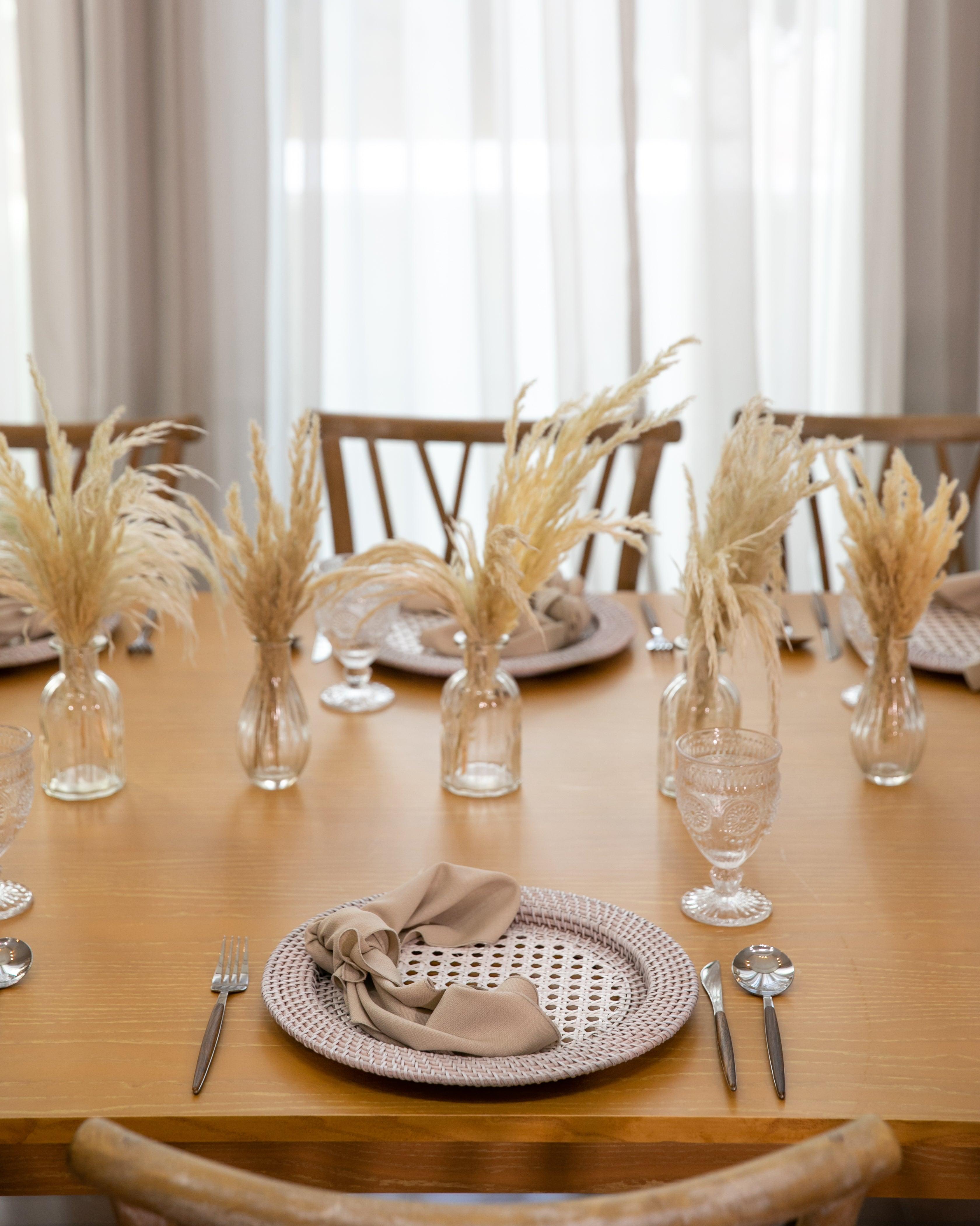 Boho & Woods party package featuring a vibrant and customizable setup designed to make your party unforgettable. This package includes a table, chairs, tableware, and centerpieces, all arranged in a simple yet classy look to ensure a remarkable event. Perfect for a party of 8 guests, with options to add more tables, chairs, and additional furniture as needed