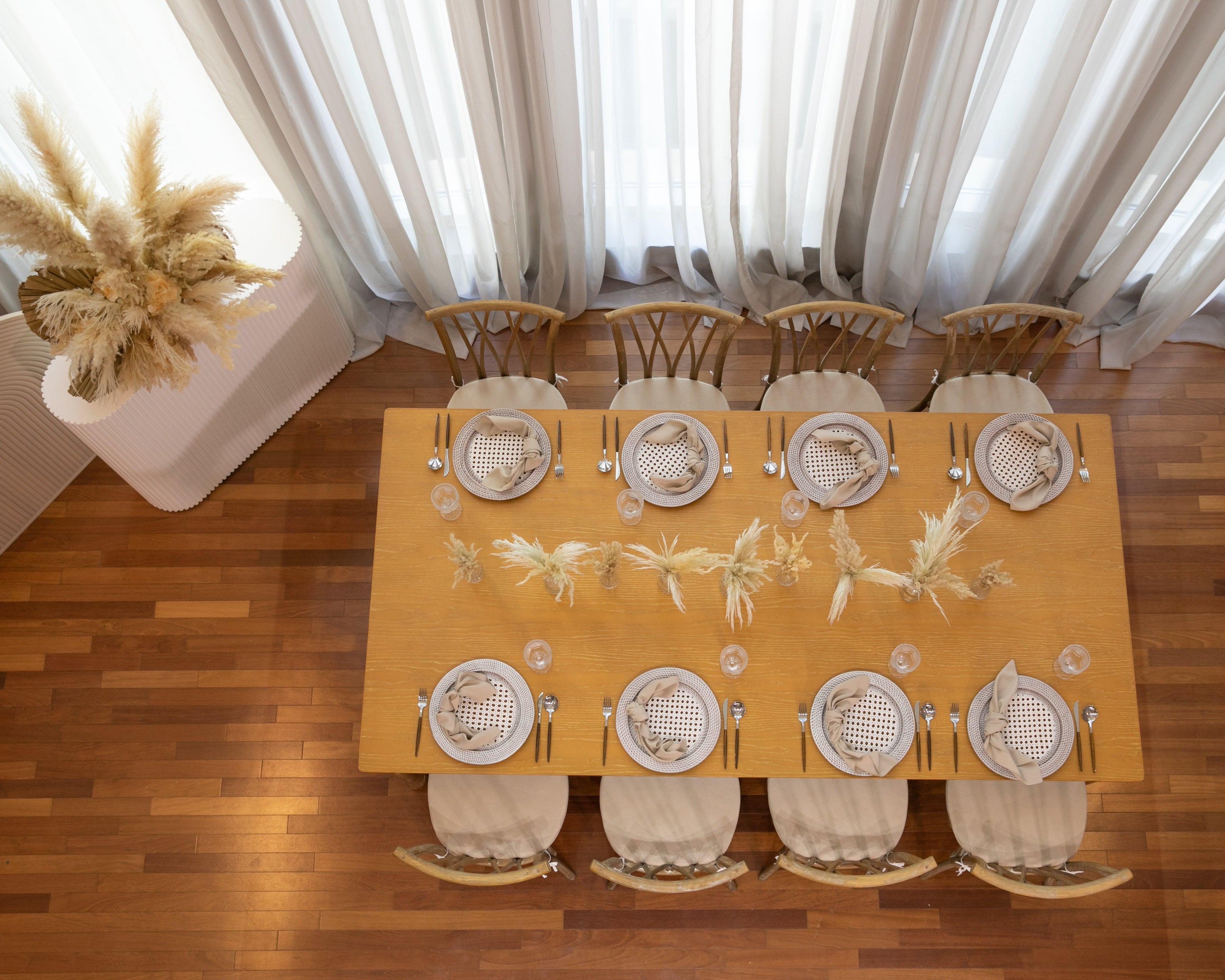 Boho & Woods party package featuring a vibrant and customizable setup designed to make your party unforgettable. This package includes a table, chairs, tableware, and centerpieces, all arranged in a simple yet classy look to ensure a remarkable event. Perfect for a party of 8 guests, with options to add more tables, chairs, and additional furniture as needed