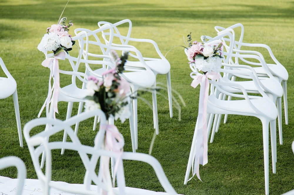 White replica Masters chair, designed with a distinctive interwoven backrest and modern aesthetic, offering a stylish and comfortable seating option.