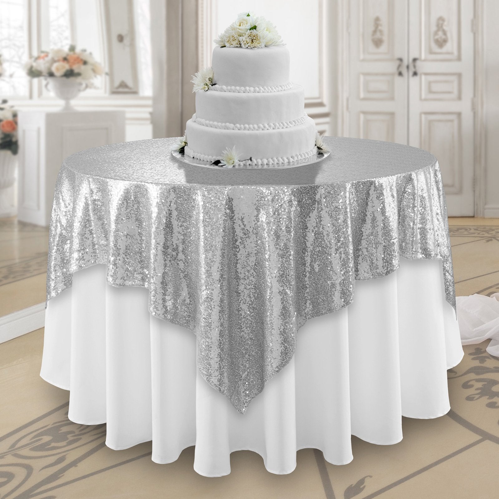 Elegant sequin overlay in a sparkling silver color, featuring a shimmering, reflective surface. The silver sequins create a dazzling effect, perfect for adding a touch of modern glamour and sophistication to table settings, event decor, or special occasions.